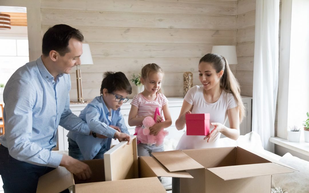 A family opening boxes