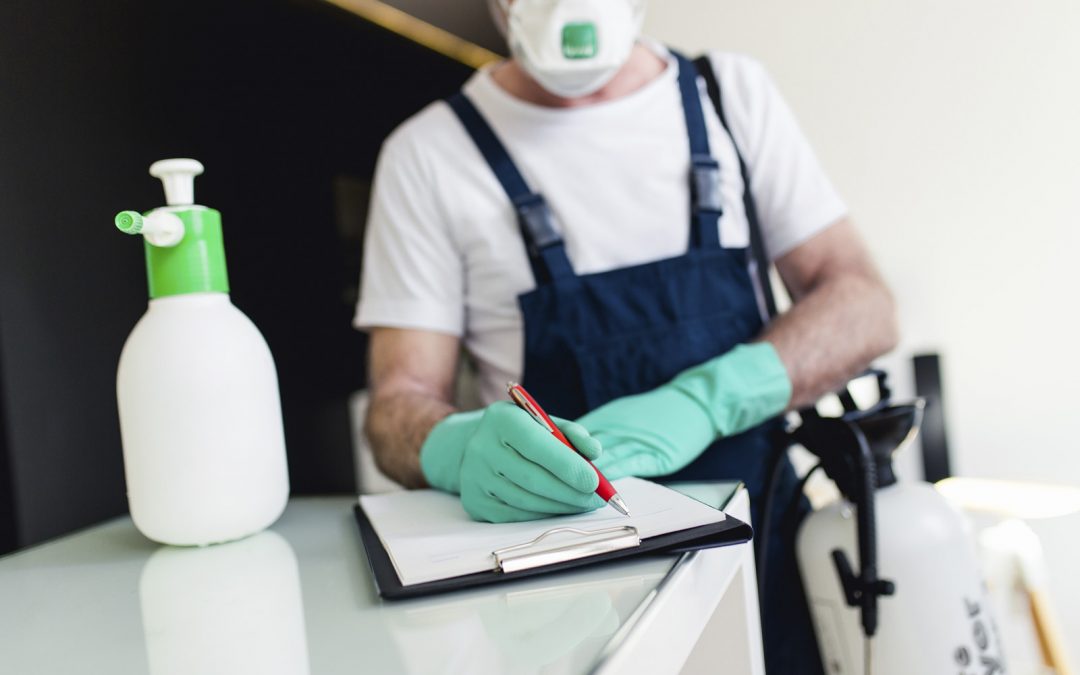 a professional is preparing the checklist for pest control